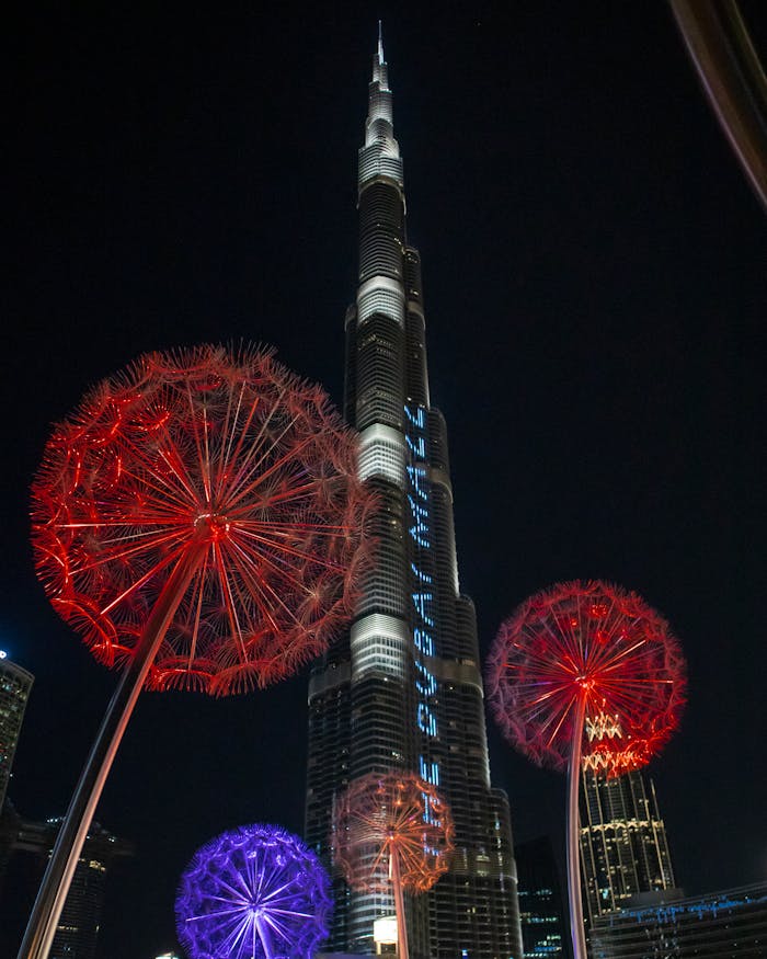 Stunning night display of Burj Khalifa in Dubai with colorful lights and iconic architecture.